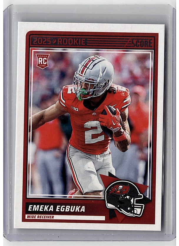 2025 Panini Score Rookie #2 Emeka Egbuka: This is a 2025 Score Emeka Egbuka rookie card, card number 2, featuring the wide receiver in his Tampa Bay Buccaneers uniform. The card displays the image quality and condition of an ungraded raw