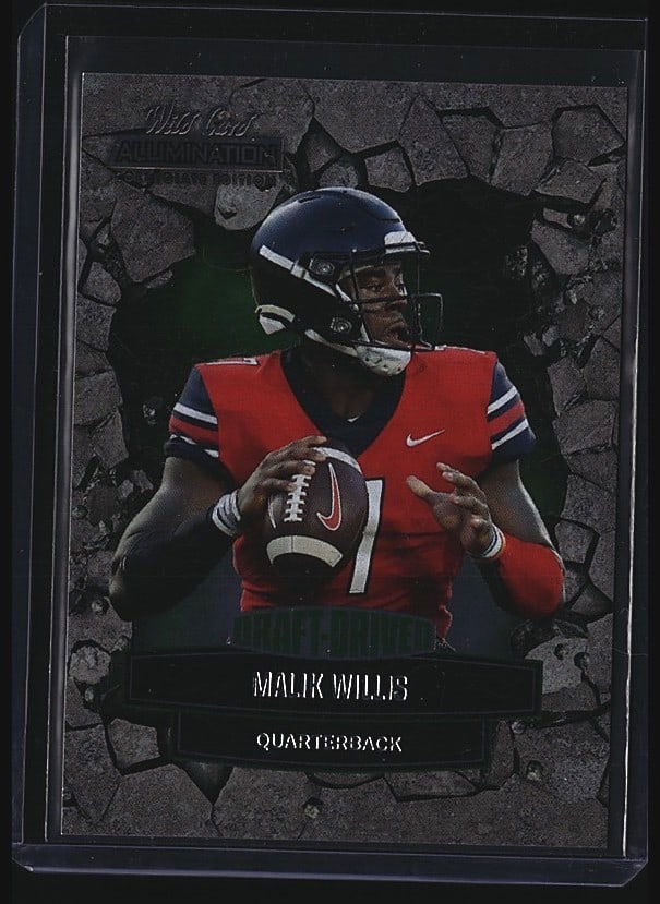 2022 Wild Card Draft Driven Malik Willis: Raw sports card featuring Malik Willis, quarterback, from the 2022 Wild Card Draft Driven set, card number ANDD-38. The card displays Willis in red team uniform holding a football. As an ungraded