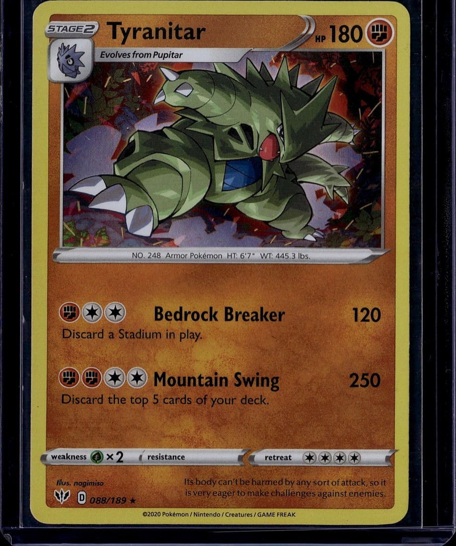 Tyranitar Stage 2 Holo 088/189 Pokemon Card: This is a raw, ungraded Tyranitar Stage 2 Holographic Pokemon Trading Card from the Sword & Shield expansion set, card number 088/189. Tyranitar is a powerful Armor-type Pokemon that evolves from