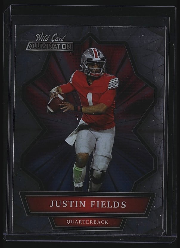 2021 Wild Card Alumination ABC-2 Justin Fields: This is a 2021 Wild Card Justin Fields quarterback rookie card, card number ABC-2. The card features Fields in a red uniform as a quarterback, standing 6'3" and weighing 223 lbs. The back includes