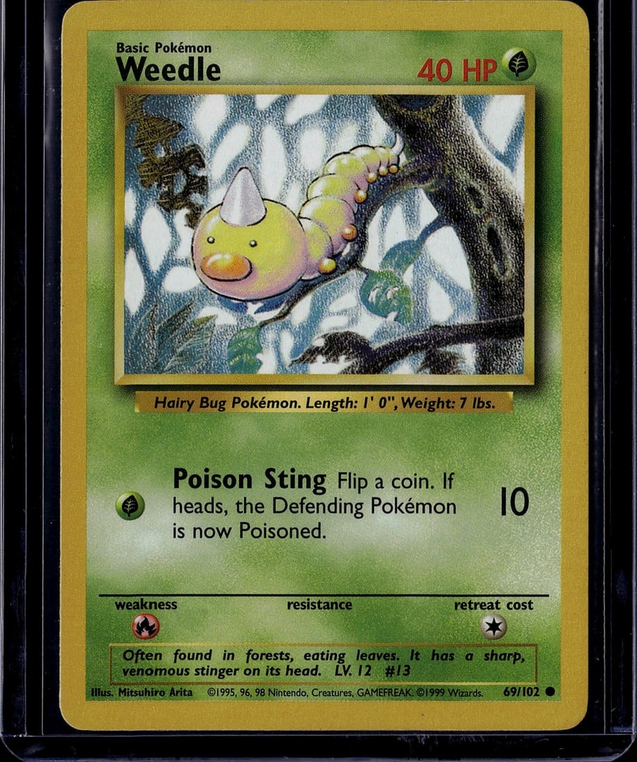 1999 Pokemon Base Set Weedle #69/102 Near Mint: This is an authentic 1999 Pokemon Base Set Weedle card (#69/102), featuring the iconic Hairy Bug Pokemon with its characteristic venomous stinger. The card displays Weedle's classic artwork by