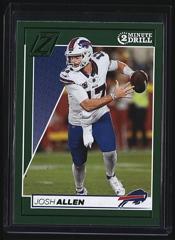 2024 Panini Zenith Josh Allen #47 Raw Football: 2024 Panini Zenith Josh Allen #47 raw football card. Features Josh Allen of the Buffalo Bills in white uniform, pictured in action pose holding the football. Card is in mint condition with sharp corne
