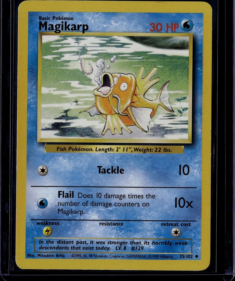 1999 Pokemon Base Set Magikarp #35/102 Card: This is an original 1999 Pokemon Base Set Magikarp card (#35/102), a classic early-era Pokemon Trading Card Game collectible. The card features the iconic orange fish Pokemon with its distinctive Flai