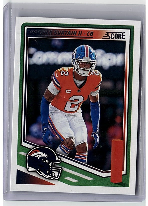 2025 Panini Score #110 Patrick Surtain II NFL: This is a 2025 Panini Score #110 Patrick Surtain II card featuring the Denver Broncos cornerback. The card showcases Surtain in his Broncos uniform against a dynamic action background, capturing his
