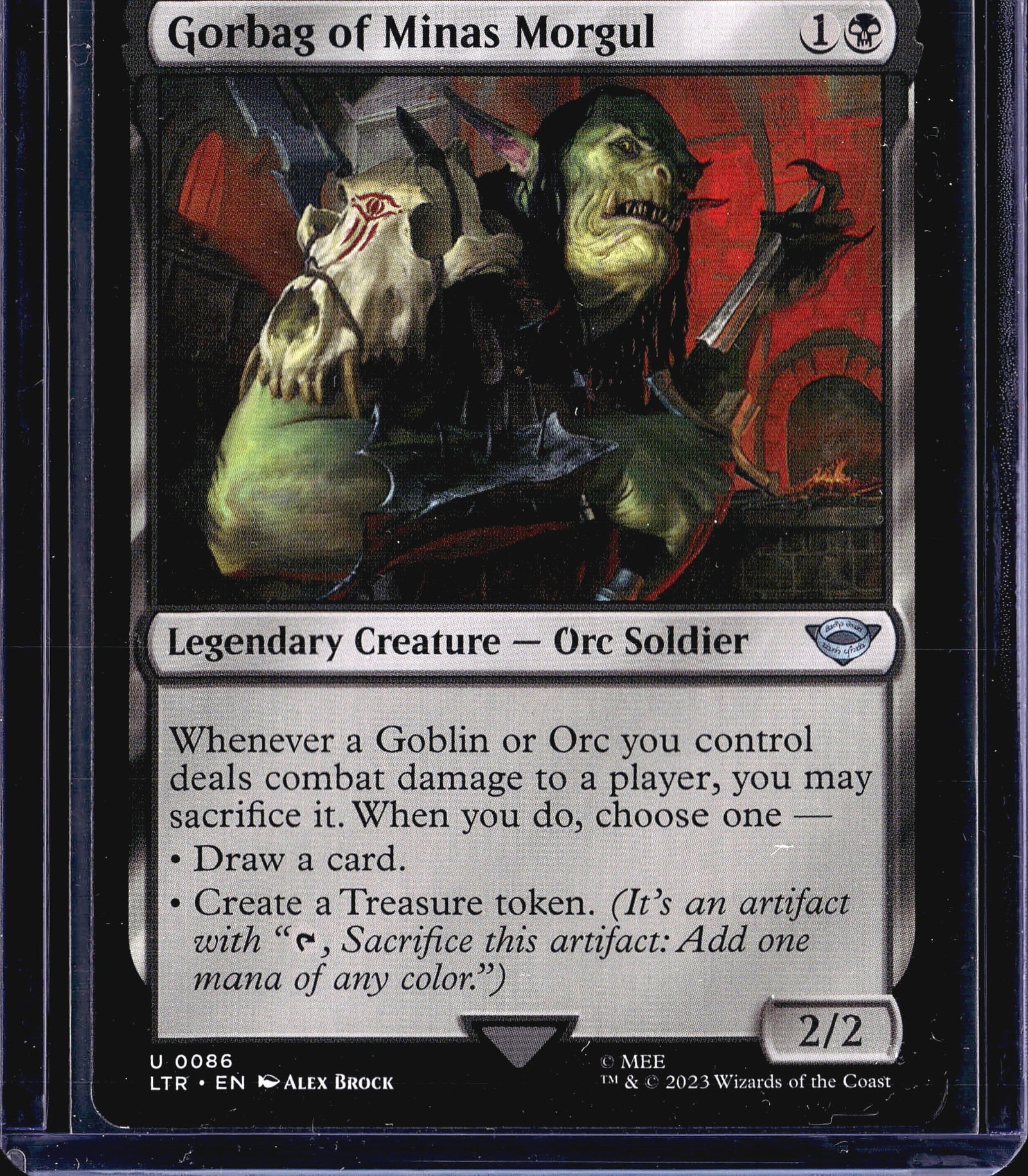 2023 Wizards of the Coast Lord of the Rings: This is a 2023 Magic: The Gathering card - Gorbag of Minas Morgul - from the Lord of the Rings: Tales of Middle-earth set (LTR), card number 0086. It is a Legendary Creature - Orc Soldier with a 2/2