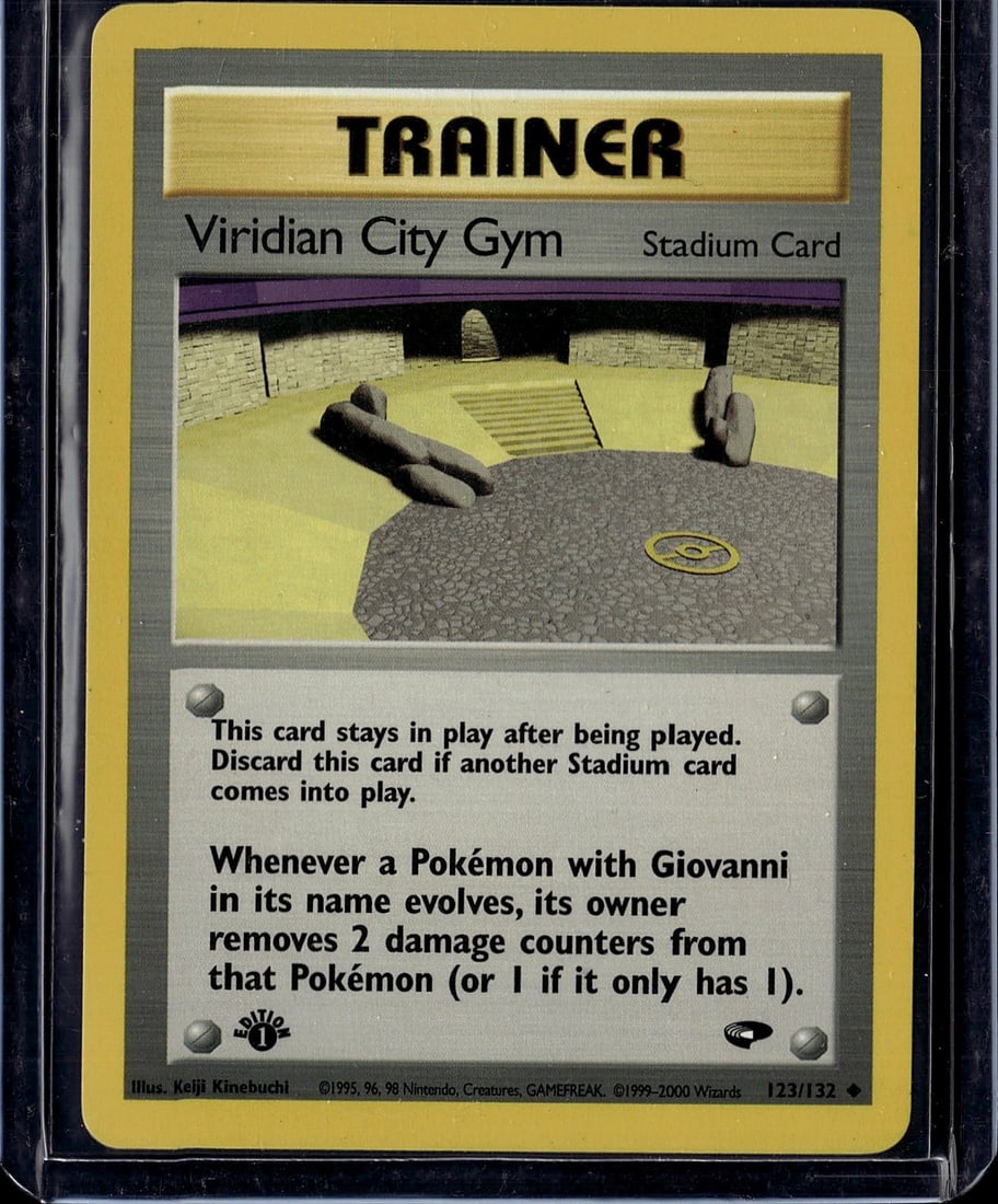 Viridian City Gym Pokemon Trainer Stadium Card: This is an original 1999 Pokemon Trading Card Game Trainer Stadium card from the Gym Heroes expansion set. Viridian City Gym is card #123 out of 132 in the set, illustrated by Keiji Kinebuchi. As a