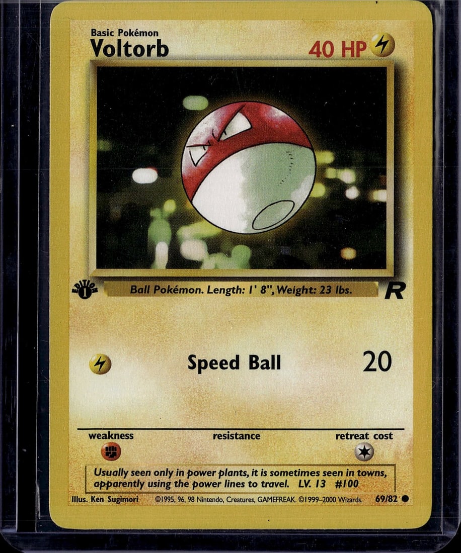 1999 Voltorb Pokemon Base Set Card #69/82: This is an authentic 1999 Voltorb Pokemon Trading Card from the Base Set, produced by Wizards of the Coast. Card #69/82 features the classic Ball Pokemon with its iconic red and white design. The