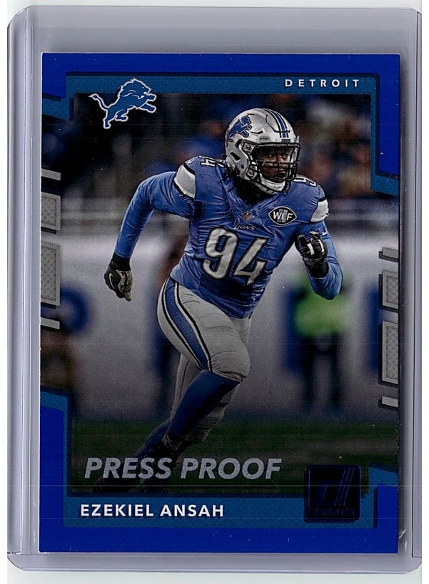 2017 Panini Donruss Press Proof Ezekiel Ansah: This is a raw Panini Press Proof football card featuring Ezekiel Ansah, a standout defensive end for the Detroit Lions. The card showcases Ansah in his signature blue Lions uniform, captured mid-play