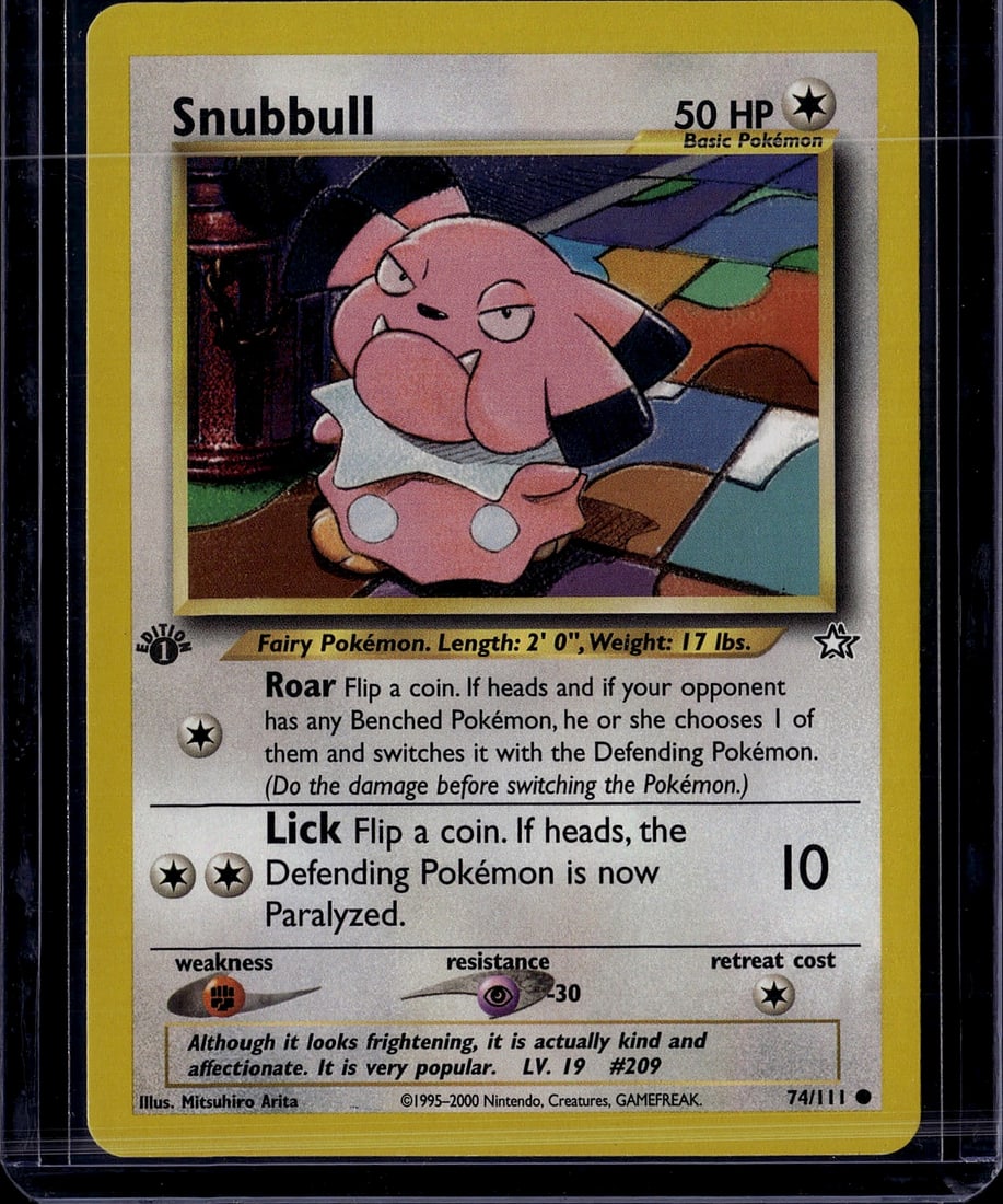 Snubbull 74/111 Base Set Pokemon Card 2000 Fairy: This is an ungraded Snubbull Pokemon trading card from the Base Set, produced by The Pokemon Company in 2000. Card number 74/111, this Fairy Pokemon features the iconic Snubbull artwork by Mitsuhiro