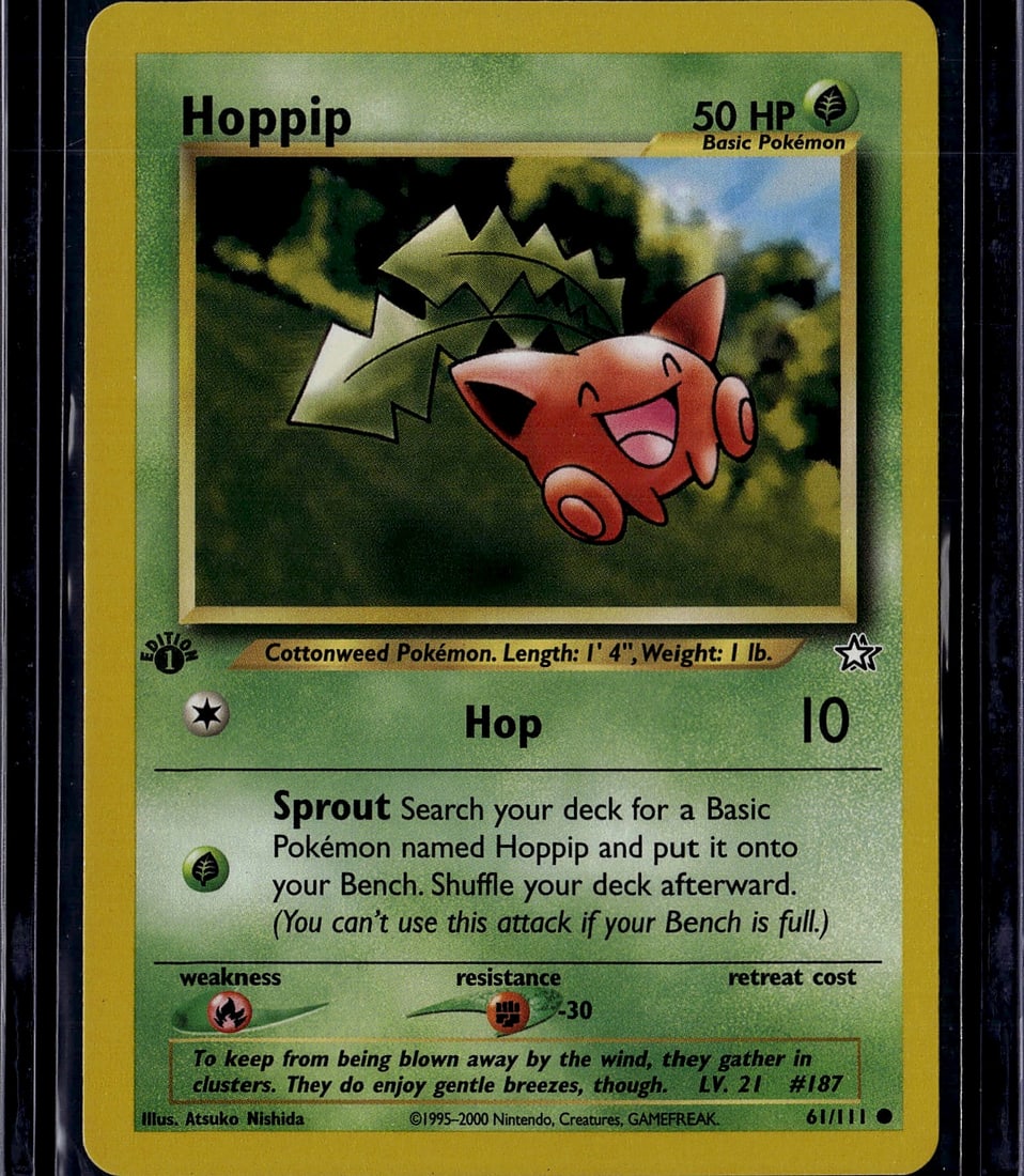 Hoppip 61/111 Neo Genesis Pokemon Card 2000: This is an ungraded Hoppip Pokemon Trading Card from the Neo Genesis set, released in 2000 by The Pokemon Company. Card number 61/111, this Basic Grass-type Pokemon features artwork by Atsuko Nishida