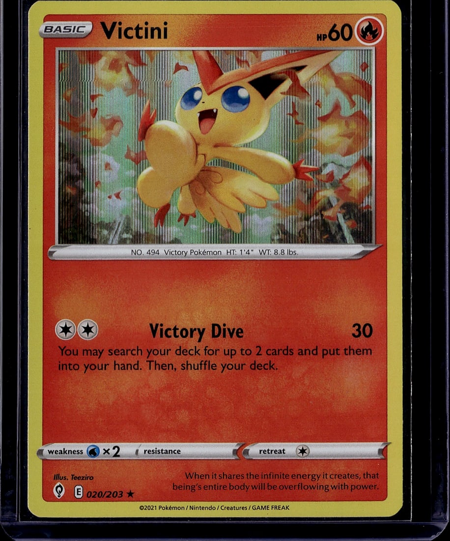 Victini 020/203 Pokemon Sword & Shield 2021: This is a Mint condition Victini Basic Pokemon card from the Sword & Shield era, cataloged as #020/203. Featuring Victini, the legendary Victory Pokemon (No. 494), this card showcases vibrant artwork