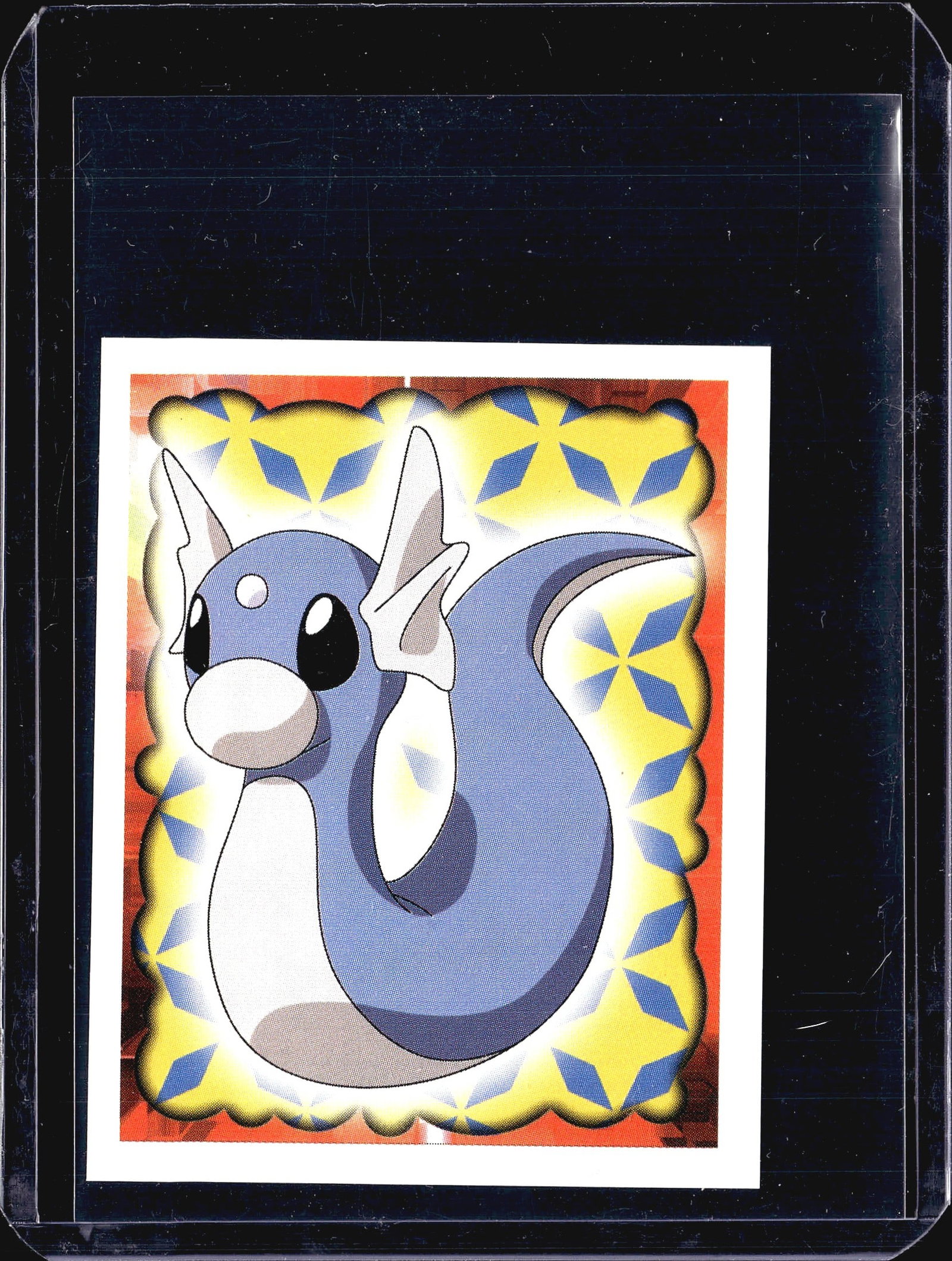 1999 Merlin Pokemon Sticker #147 Dratini Foil: This is a 1999 Merlin Collections Pokemon sticker numbered 147, featuring Dratini, the Dragon-type Pokemon. The front displays a colorful foil-style design with a yellow star-patterned background, red