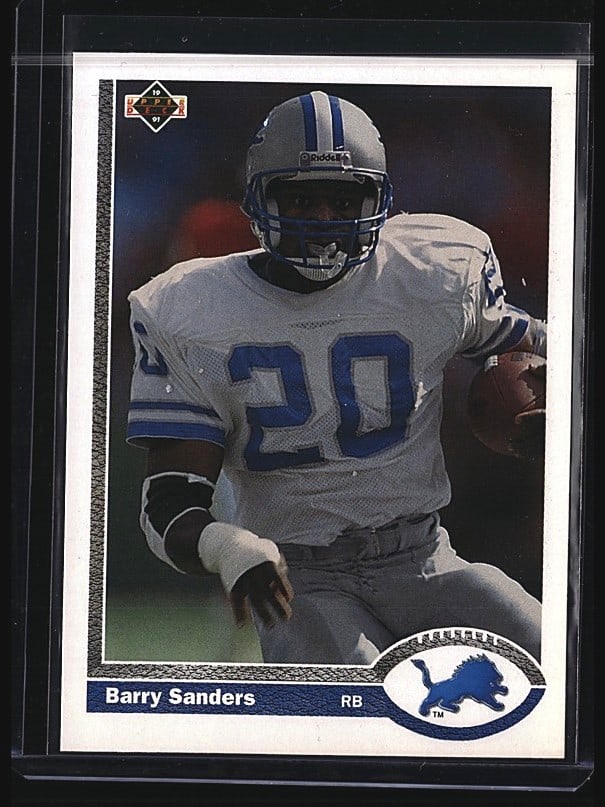 1991 Upper Deck Barry Sanders #444 Football Base: Raw 1989 Upper Deck Barry Sanders rookie card #444. The card features Sanders in a Detroit Lions uniform, number 20, in his iconic rookie season. This is a classic early-era Upper Deck football card s
