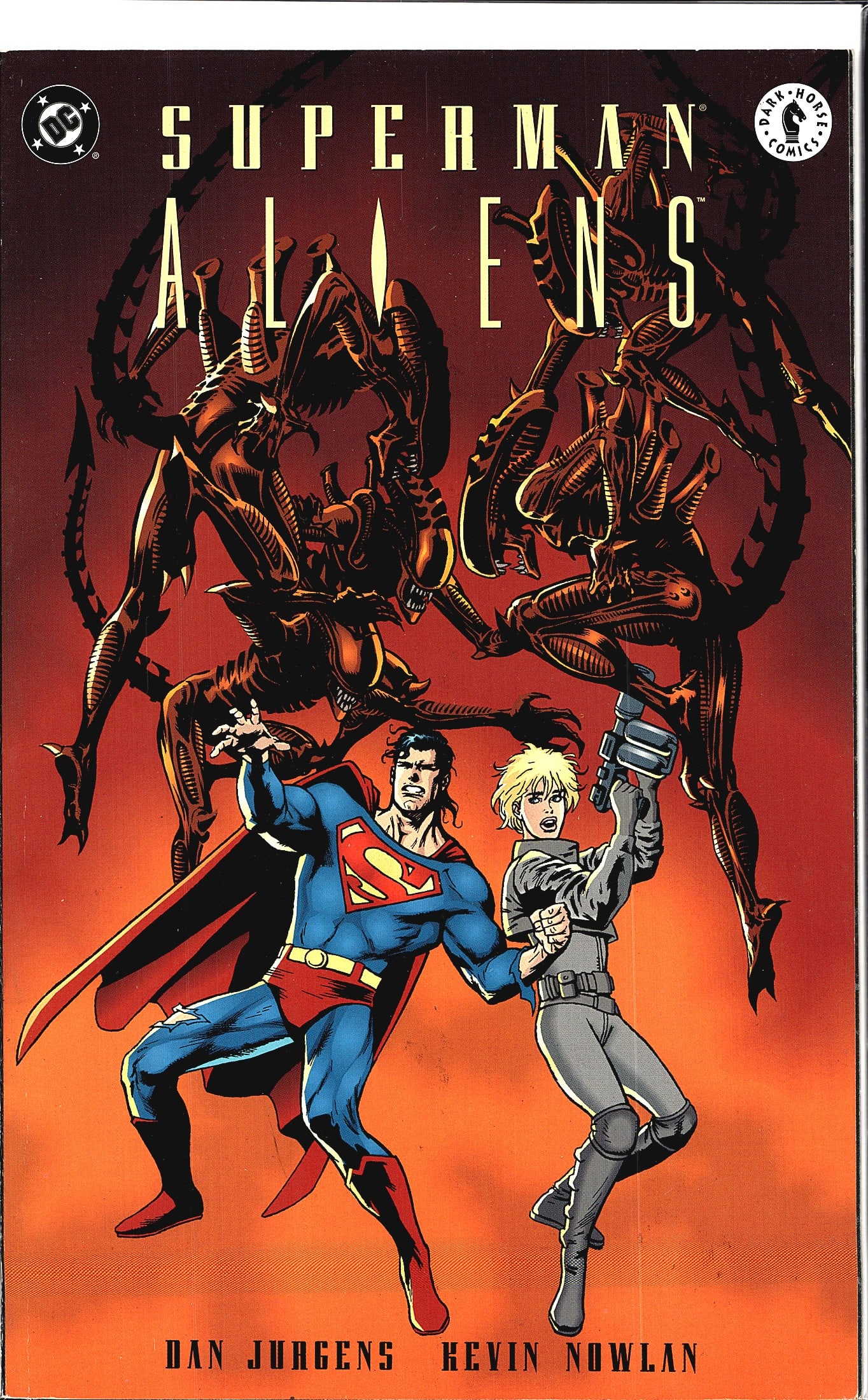 1995 DC Comics Superman vs. Aliens #2 Superman: Superman/Aliens is a crossover comic published jointly by DC Comics and Dark Horse Comics, written and drawn by Dan Jurgens with inks by Kevin Nowlan. The cover features Superman and a female