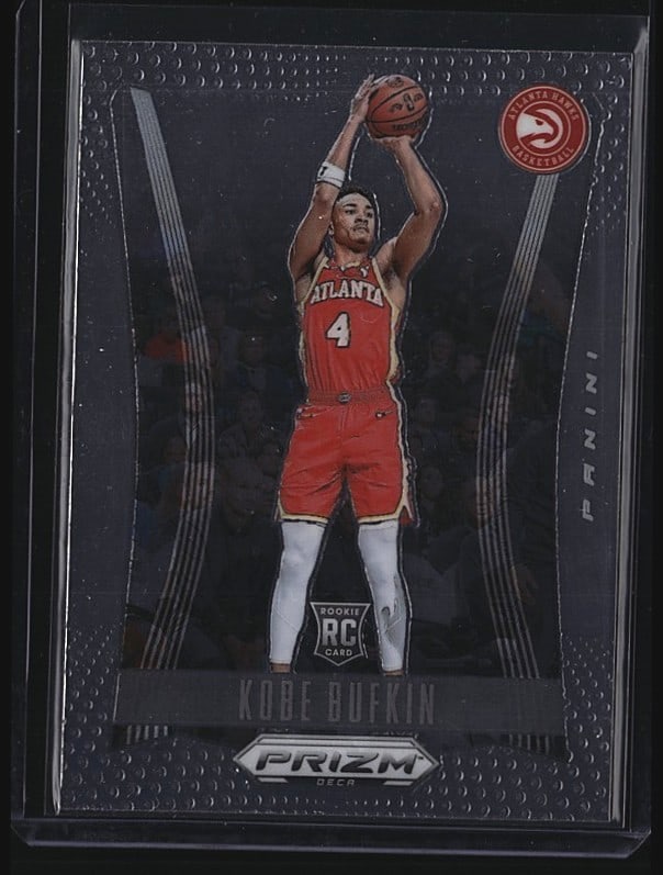 2023 Panini Prizm Kobe Bufkin #157 Rookie: 2023-24 Panini Prizm Kobe Dukekin rookie card #157. Features the Atlanta Hawks player in red uniform shooting a basketball. Card displays sharp corners, clean surface, and vibrant color printing