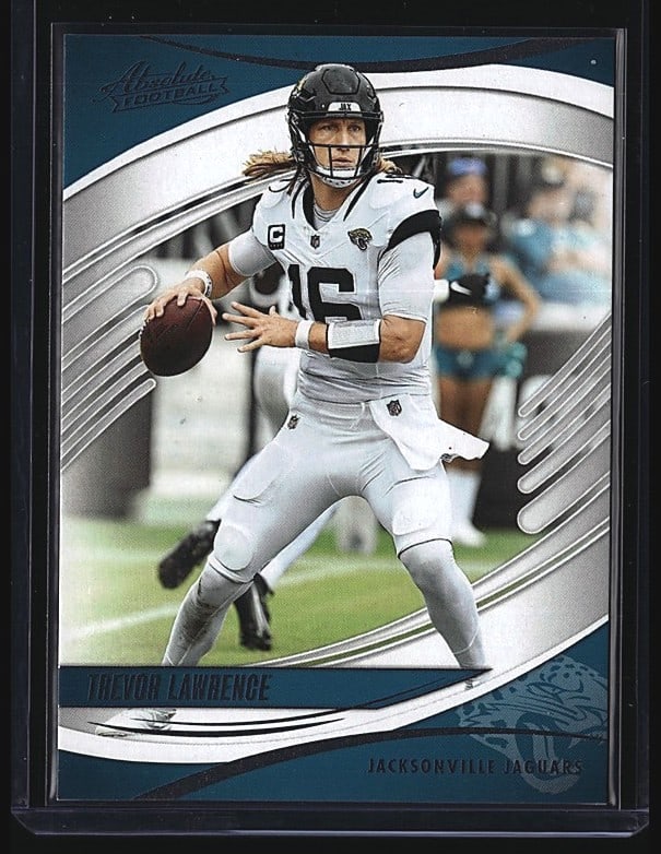 2025 Panini Absolute Football Trevor Lawrence: 2025 Panini Absolute Football Trevor Lawrence #49 quarterback card in raw (ungraded) mint condition. The card features Lawrence in Jacksonville Jaguars white uniform, captured mid-throw with the