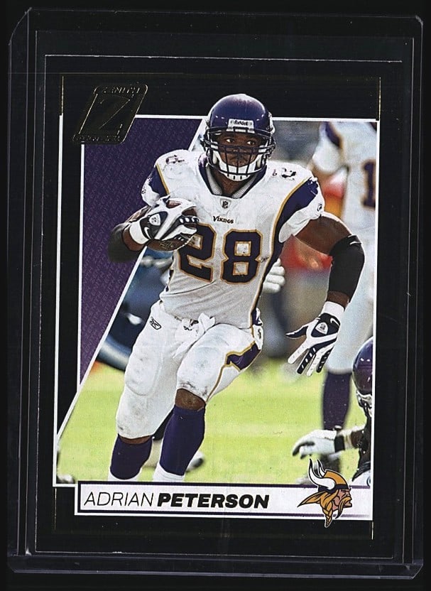 2024 Panini Zenith Adrian Peterson #28 Minnesota: 2024 Panini Zenith Adrian Peterson #28 raw football card featuring the Minnesota Vikings running back in white uniform during game action. The front displays a vibrant action photograph with the Vikin