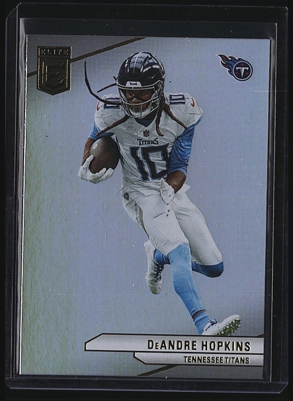 2024 Panini Donruss Elite #22 DeAndre Hopkins: 2024 Panini Donruss Elite #22 DeAndre Hopkins Tennessee Titans raw football card. Front features action photography of Hopkins in full uniform carrying the football. Reverse side displays the Titans l