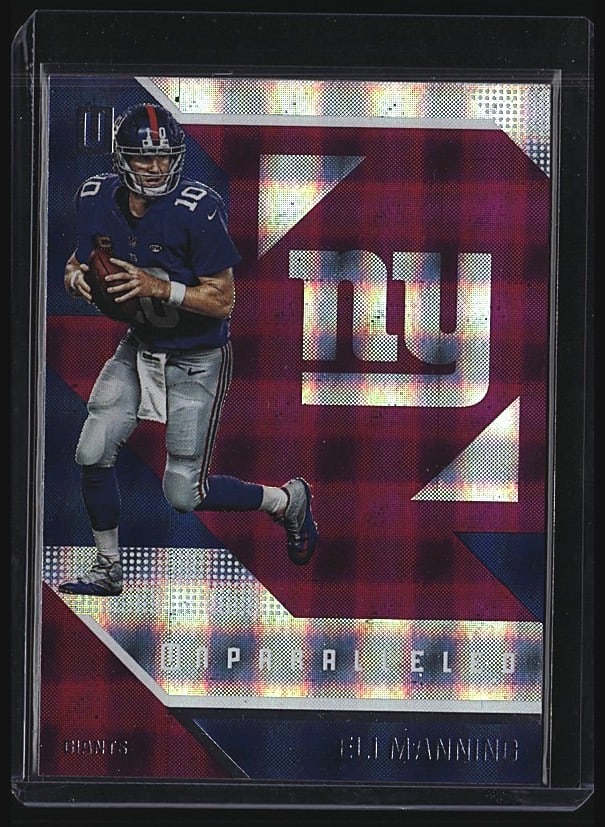 2016 Panini Unparalleled Eli Manning #4 Football: 2018 Panini Unparalleled Eli Manning #4 raw football card featuring the New York Giants quarterback. Card shows Manning in Giants blue uniform in mid-throw pose with the team logo. Back includes caree