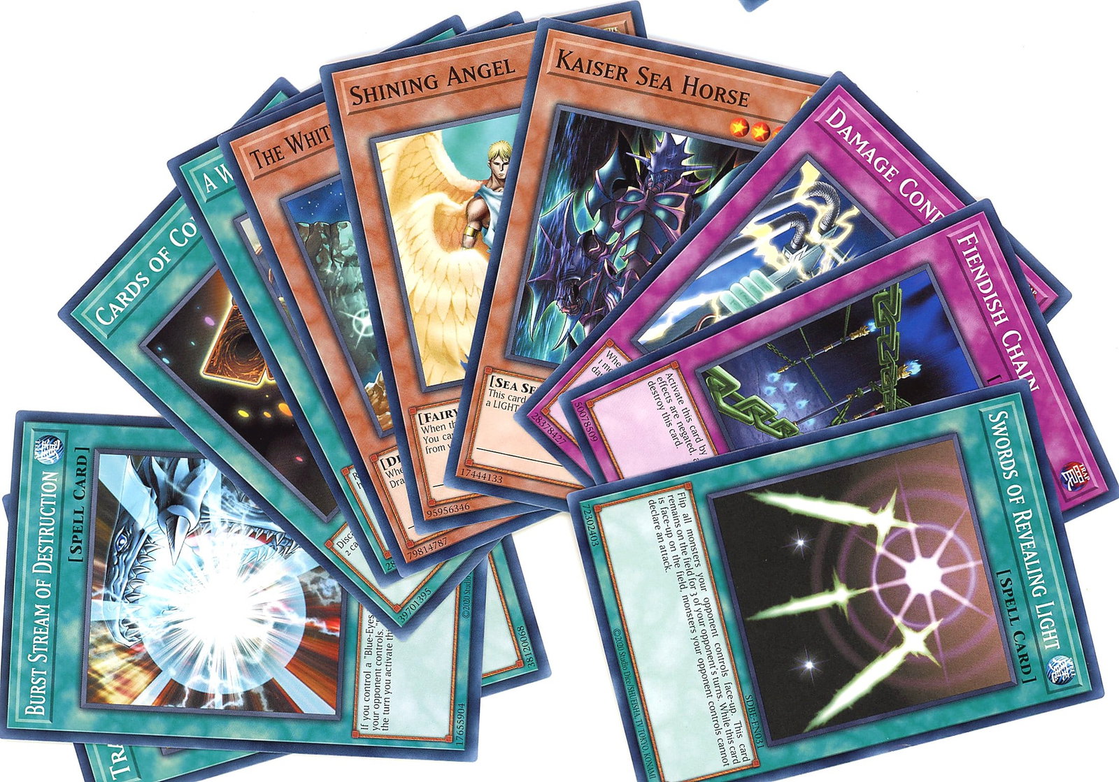 Yu-Gi-Oh Trading Card Lot Non-Holo TCG Cards: This lot contains multiple Yu-Gi-Oh! Trading Cards featuring non-holographic finishes. The cards display the distinctive blue card backs and borders characteristic of the Yu-Gi-Oh TCG, with vibrant