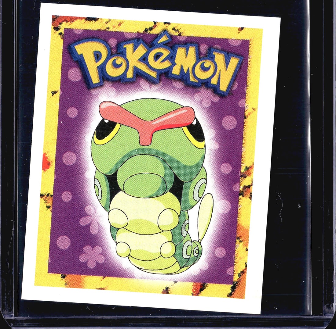 1999 Merlin Topps Pokemon Sticker #10 Caterpie: This is a 1999 Merlin Collections Pokemon sticker numbered #10, featuring Caterpie on a purple polka-dot background with the iconic Pokemon logo at the top. The sticker is produced under an official
