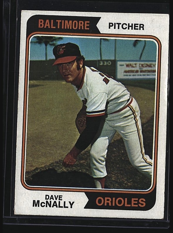1974 Topps Dave McNally Baltimore Orioles: 1974 Topps Dave McNally baseball card #235 featuring the Baltimore Orioles pitcher. This raw single shows McNally in his Orioles uniform in a fielding pose. The card displays typical 1974 Topps design