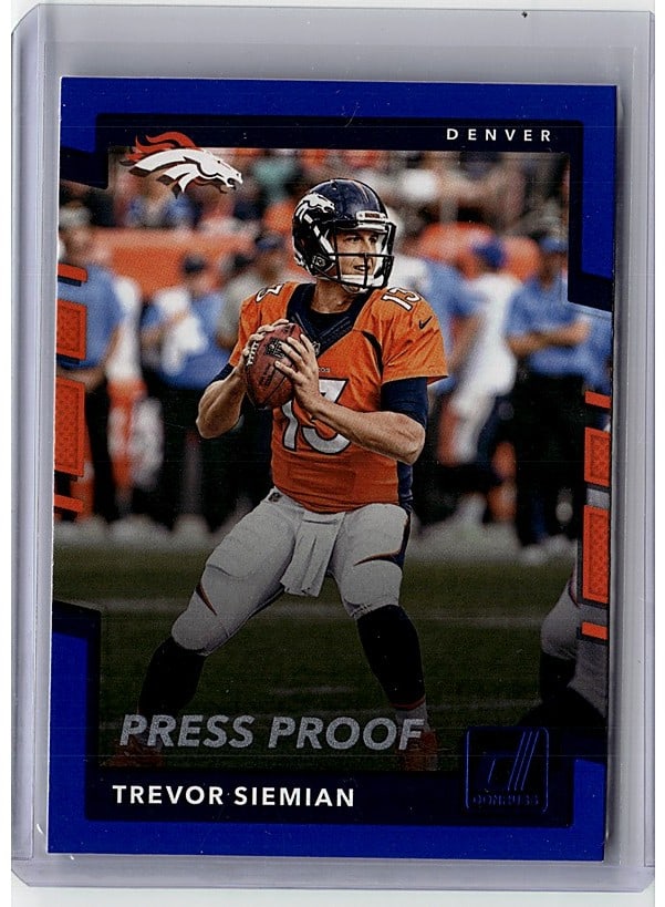 2017 Panini Donruss Trevor Siemian #141 Press: This is a 2015 Panini Prestige Trevor Siemian Press Proof football card featuring the Denver Broncos quarterback in his iconic orange jersey. The Press Proof designation makes this a special parallel 