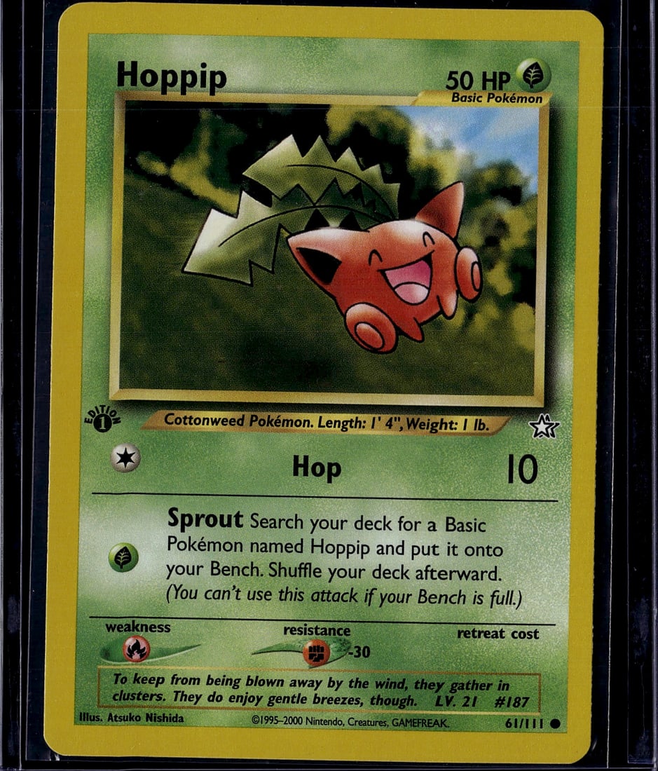 Hoppip Base Set 61/111 Pokemon Card 2000 - Near: This is an original Hoppip Pokemon Trading Card from the Base Set, released in 2000 by The Pokemon Company and Nintendo. Card #61/111 features the iconic Grass-type Cottonweed Pokemon with its distinc