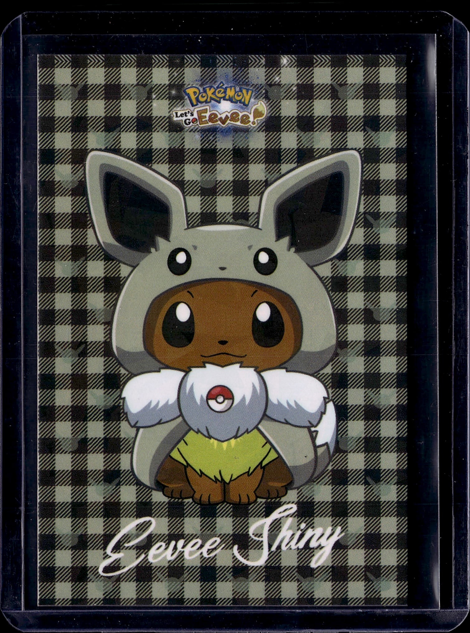 Pokemon Let's Go Eevee Promotional Card: This is an official Pokemon Let's Go Eevee promotional card featuring the iconic Eevee character in its adorable Let's Go form. The card showcases beautiful artwork with Eevee wearing a trainer