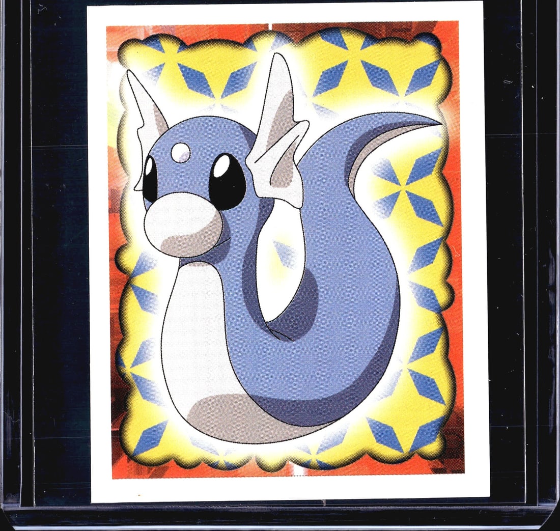 1999 Merlin Pokemon Collection Sticker #147: This is sticker #147 from the 1999 Merlin Collections Pokemon sticker series, an officially licensed Nintendo product. The front features Dratini, the Dragon-type Pokemon, depicted in its classic
