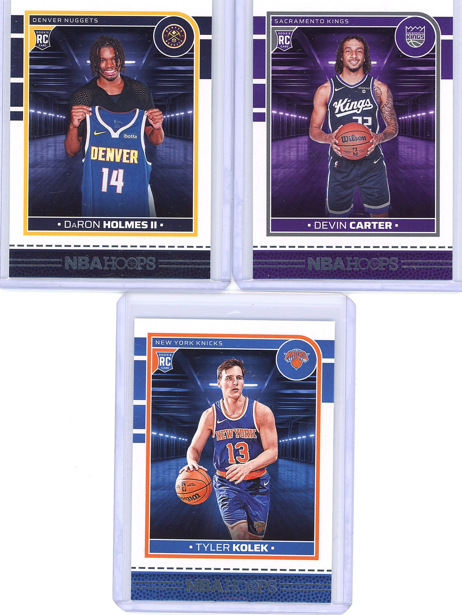2024-25 Panini NBA Hoops 264 243 252 Kolek: Lot of three 2024-25 Panini Hoops Basketball rookie cards featuring Daron Holmes II (Denver Nuggets, #252), Devin Carter (Sacramento Kings, #243), and Tyler Kolek (New York Knicks, #264). Each card is