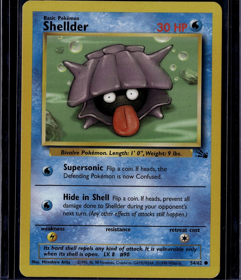 Shellder Base Set 54/62 Pokemon Card 1999 - Raw: This is an authentic Shellder Pokemon trading card from the iconic 1999 Base Set, card number 54/62. Shellder is a Basic Water-type Bivalve Pokemon featuring the classic artwork by Mitsuhiro Arita.