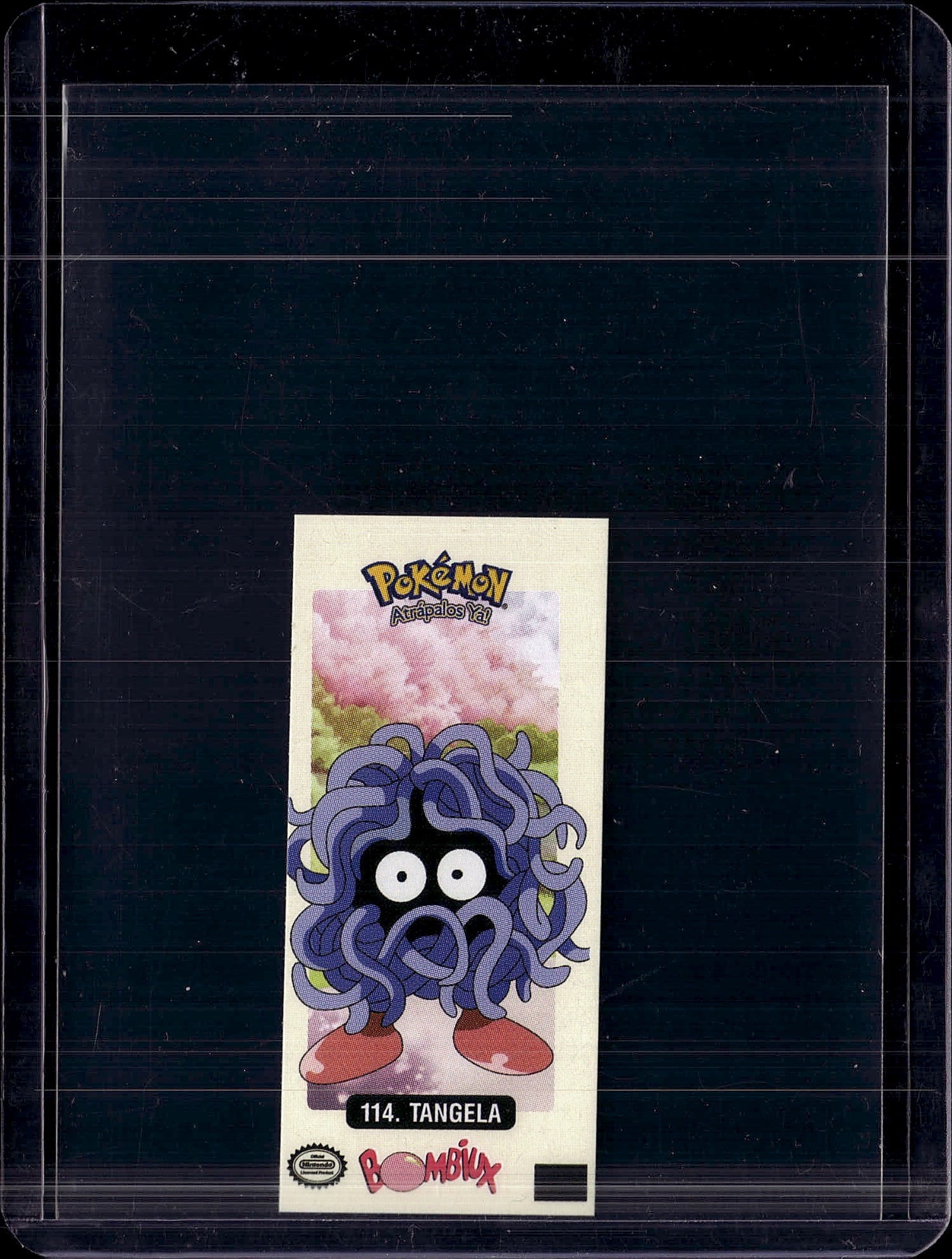 1999 Bandai Pokemon Artaidos Ya #114 Tangela: This is a rare 1999 Bandai Pokemon Artaidos Ya #114 Tangela trading card, featuring the iconic vine-covered Pokemon with its characteristic bulbous eyes and red feet. The card displays vibrant,