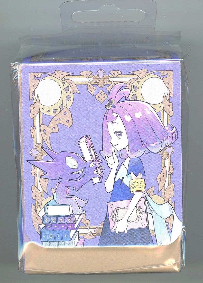 2024 Pokemon Mega Symphonia Acerola & Sableye: This is an official Pokemon Promo Deck Box still sealed in its original clear plastic retail packaging. The artwork features a purple-haired female Pokemon Trainer character alongside what appears to