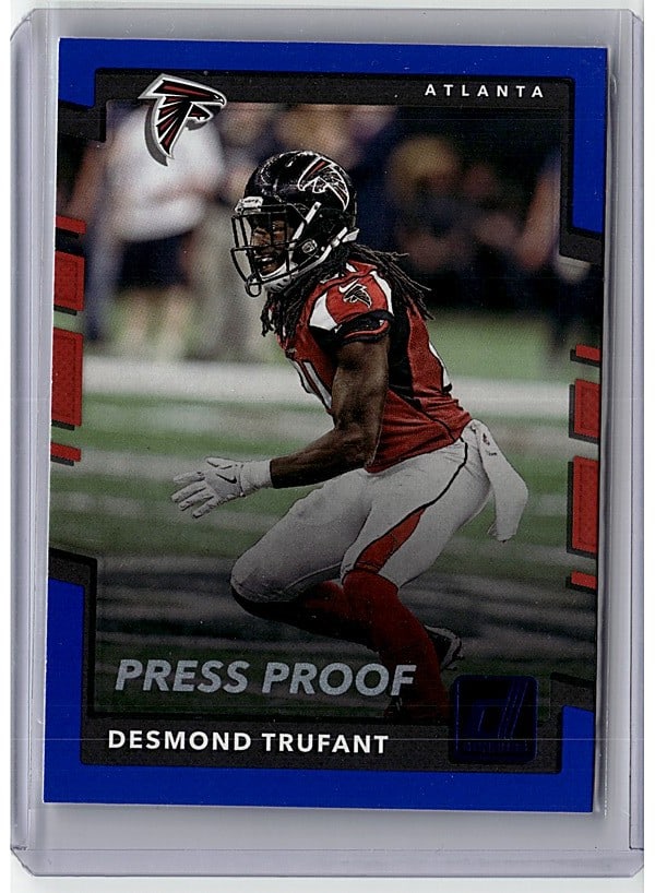 2013 Topps Football Card #184 Desmond Trufant: This is a raw sports card single featuring Desmond Trufant, defensive back for the Atlanta Falcons. The card captures an action shot of Trufant in his red Falcons uniform, displaying professional