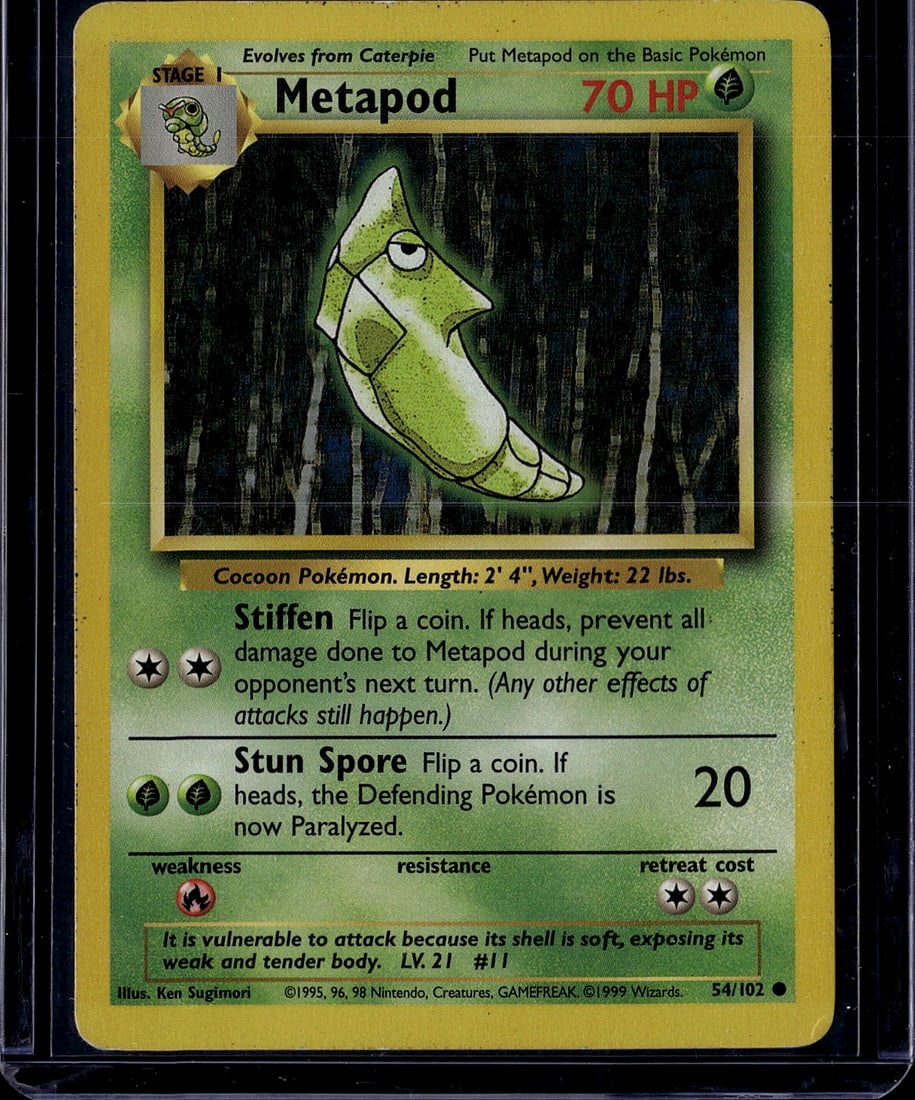Metapod Base Set 54/102 Pokemon TCG Card 1999: This is an original 1999 Base Set Metapod Pokemon trading card (54/102), a Stage 1 Cocoon Pokemon that evolves from Caterpie. The card features classic Ken Sugimori artwork and displays the iconic gre