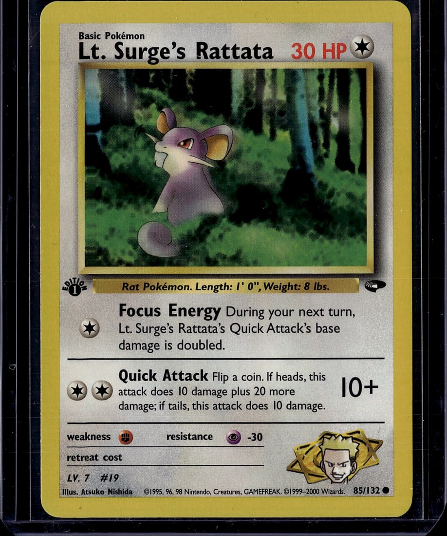 Lt. Surge's Rattata 85/132 Gym Heroes Pokemon: This is a raw Lt. Surge's Rattata Pokemon Trading Card from the 1999 Gym Heroes set, card number 85/132. This basic Pokemon card features the iconic purple rat Pokemon with 30 HP and was illustrated