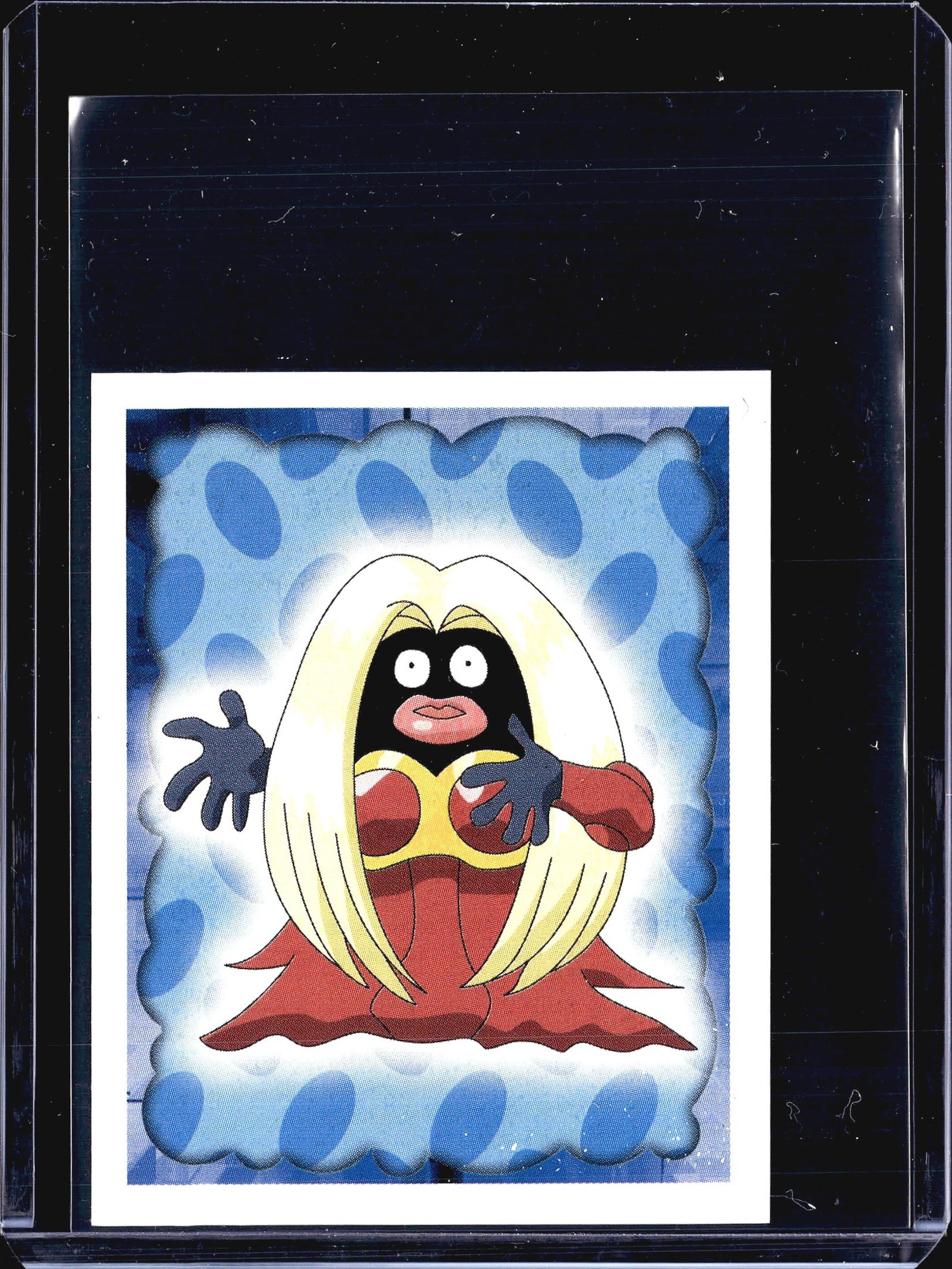 1999 Merlin Pokemon Sticker #124 Jynx Merlin: This is sticker #124 from the 1999 Merlin Pokemon Collection series, featuring the Psychic-type Pokemon Jynx. The sticker displays Jynx in a dramatic pose surrounded by a glowing blue cloud-patterned