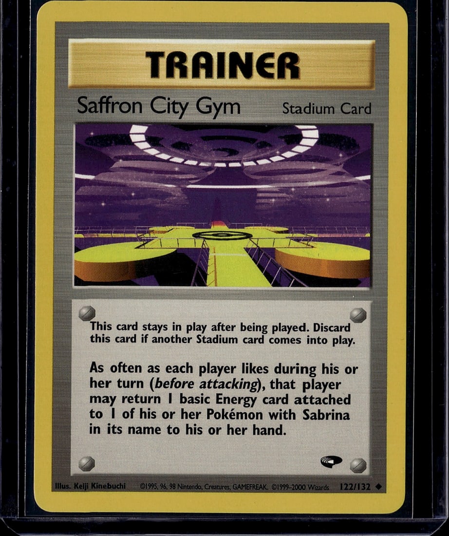 Saffron City Gym Pokemon Trainer Card 122/132: This is a Saffron City Gym Trainer Stadium Card from the Gym Heroes set, released in 1999 by Wizards of the Coast. Card number 122/132 features an illustration of the iconic Saffron City Gym interior
