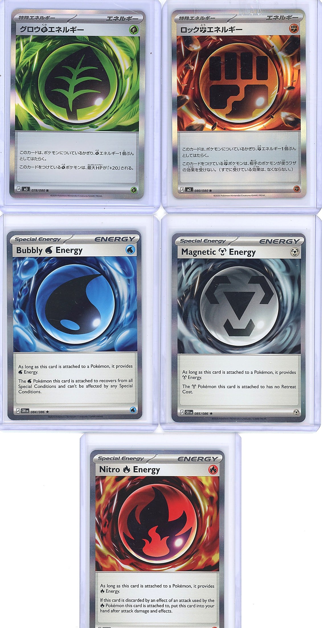 5-Card Lot Modern Japanese Holo Pokemon Energy: This lot contains five Japanese-language Pokemon Special Energy cards in holographic finish, displayed in protective sleeves. The cards include Grookey Energy (Grass), Rock-type Energy (Fire), Bubbly