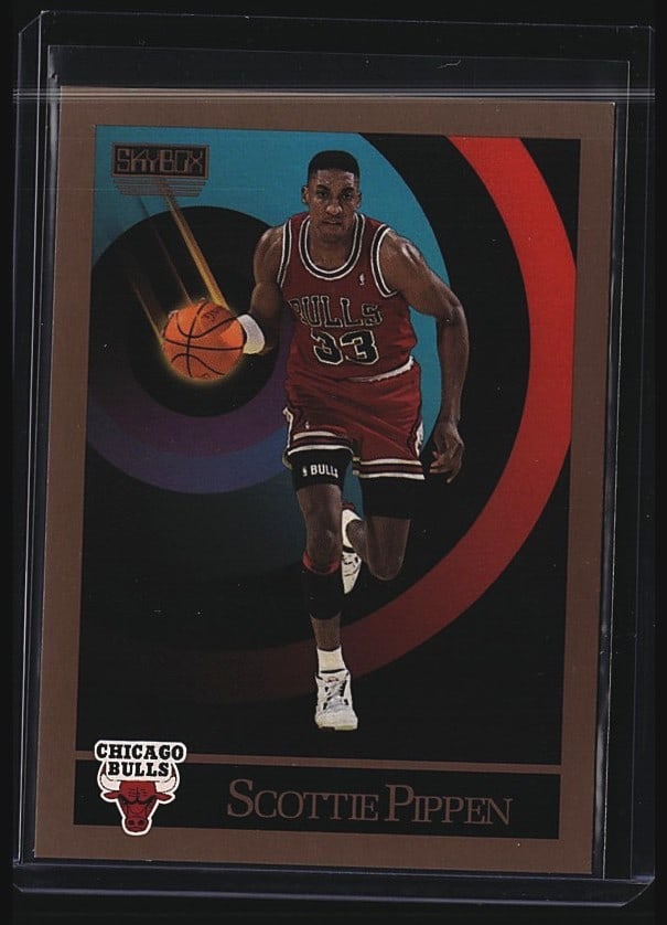 1990 Skybox #46 Scottie Pippen Chicago Bulls: 1990 Skybox #46 Scottie Pippen Chicago Bulls basketball card. Raw single featuring Pippen in white Bulls uniform as a forward measuring 6'8" and 210 lbs. Card includes career statistics on reverse