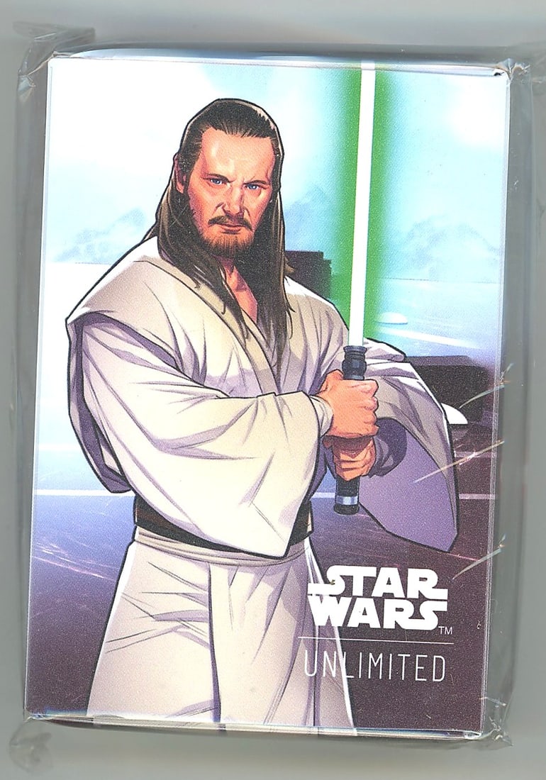 2024 Fantasy Flight Games Star Wars Unlimited: This is an official Star Wars Unlimited Promo Deck Box featuring stylized comic-art illustration of Qui-Gon Jinn wielding a green lightsaber in his iconic Jedi robes. The artwork has a dynamic illustr