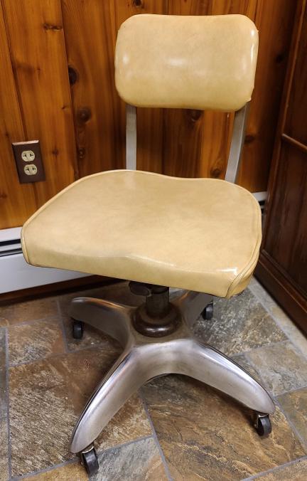 Industrial Aluminum MCM Rolling Office Chair by: Description: This lot includes a mid-century modern industrial rolling aluminum office chair made by GoodForm. Marked on backside.Condition: Chair is in excellent condition with original upholstery.Sh