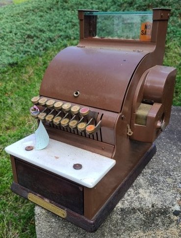 Antique National Cash Register Model #717: Description: This lot includes an antique national cash register. Register is made of painted metal and wood. No keys. Condition: Register is in beautiful original antique condition. Fully Functional.