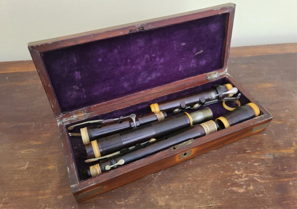 Dollard Dublin 19th Century Irish Flute: Description: This lot includes a Dollard Dublin 19th century Irish Flute. Condition: Flute is in good antique condition with some missing bone accents. Comments: This flute is made of wood and bone an