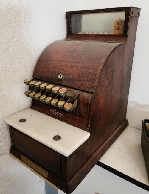 National Model 711 Cash Register: Description: This lot includes an antique National cash register. Model 711. No key. Condition: Register is in overall good antique condition with wear consistent with age and use. Appears to function