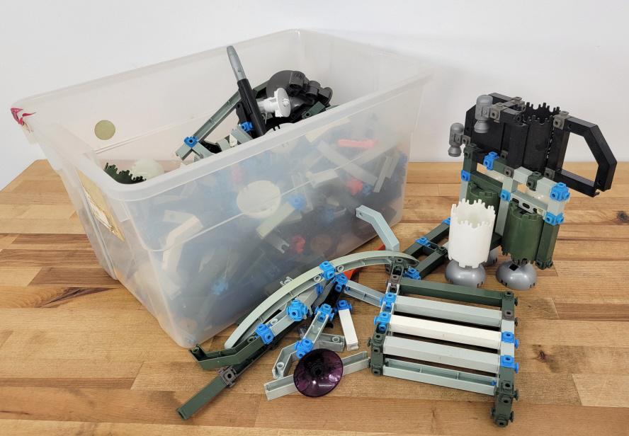 Lot of 1980's Construx Building Blocks: Description: This lot includes a small tote filled with Construx building blocks from the 1980's. You get everything you see in the photos. Condition: Some wear may be present associated with age and 