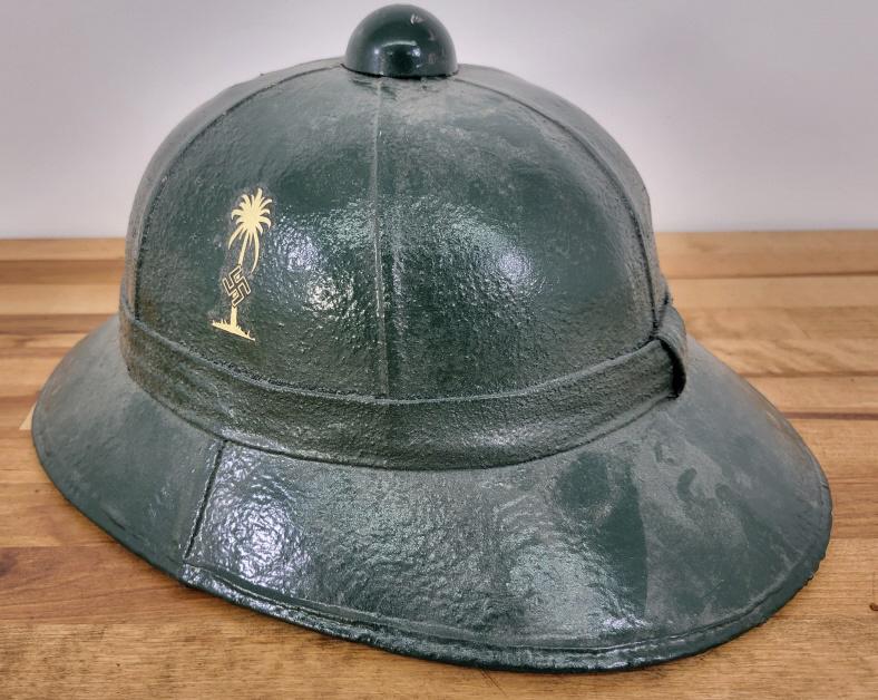 German Afrika Korps Tropical Pith Sun Helmet - Double Decal: Description: WWII German Afrika Korps Tropical Pith sun helmet. Featuring double decals with the Afrika Korps Palm tree decal on the Right ride.