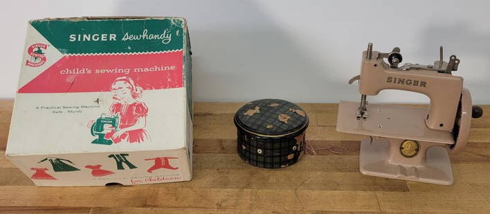 Singer Sew handy Child's Sewing Machine: Description: This lot includes a vintage Singer Sew handy child's sewing machine in the box. See photos for details. Condition: Expected surface wear associated with age and use, otherwise in overall