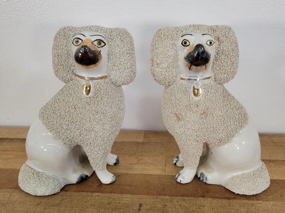 Pair of Staffordshire Porcelain Dogs: Description: This lot includes a pair of white porcelain Staffordshire dog figures. These appear to be antique in age, though exact age is unknown. Unmarked Condition: Minor expected surface wear asso